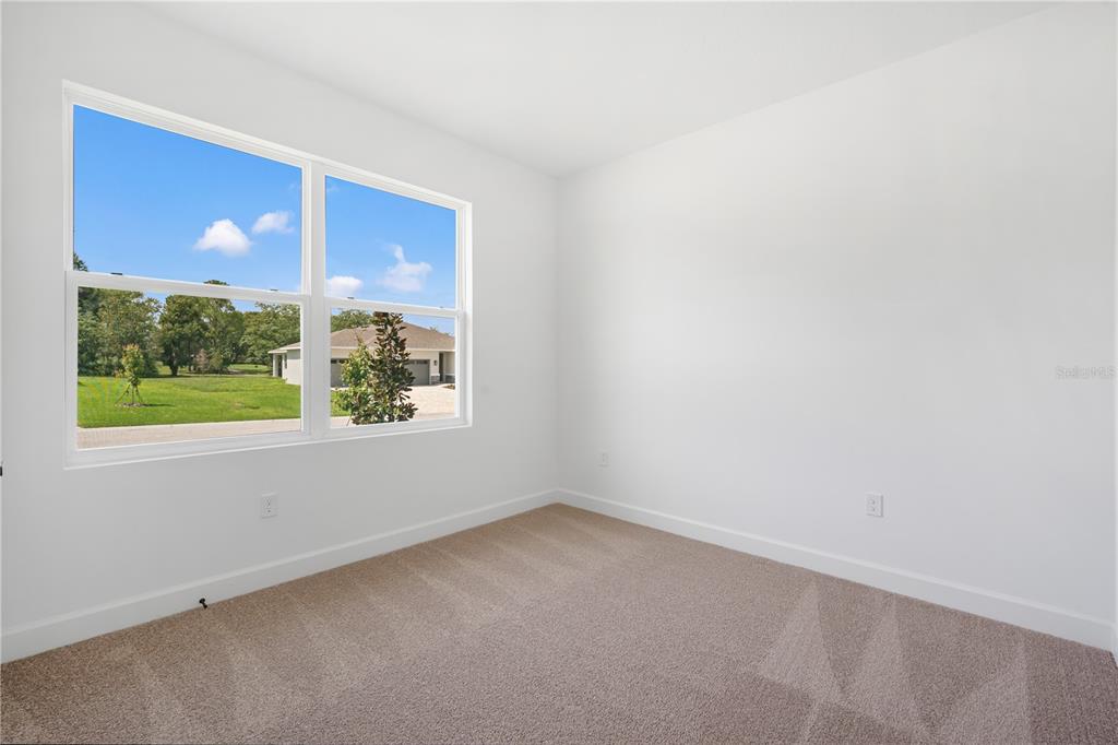 9196 Players Drive Weeki Wachee, FL 34613 - Photo 6 of 29 an empty room with a window