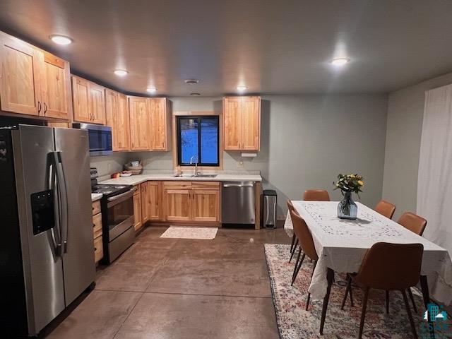 265 Mink Ranch Road Lutsen, MN 55612 - Photo 4 of 32 Kitchen and dining area featuring wood cabinetry, stainless steel appliances, and recessed lighting