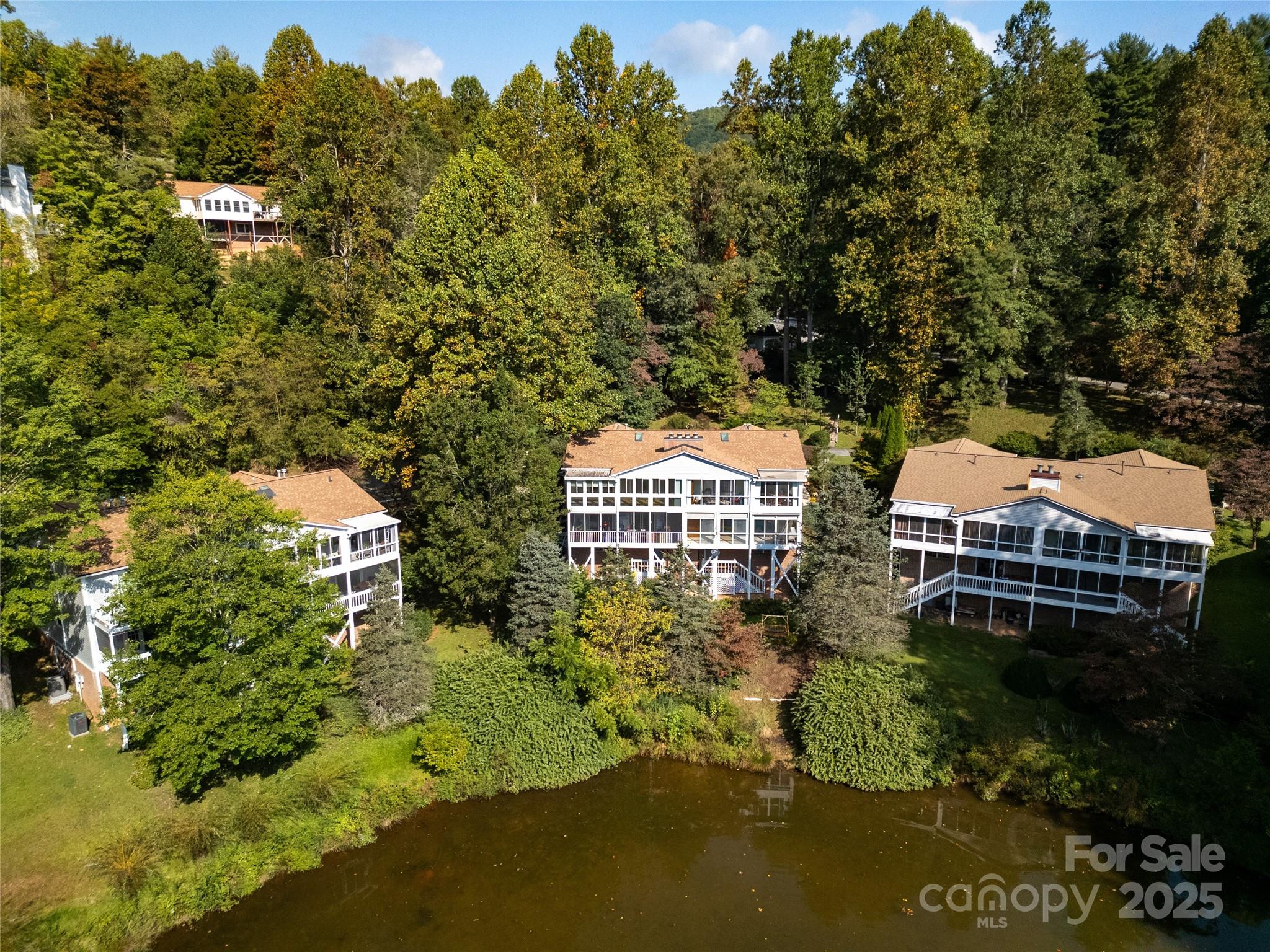110 Lakeview Court Brevard, NC 28712 - Photo 24 of 30 an aerial view of a house with swimming pool and green space