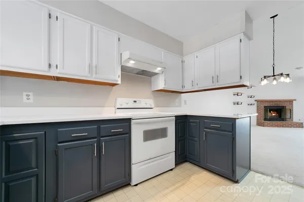 a kitchen with cabinets appliances and a sink