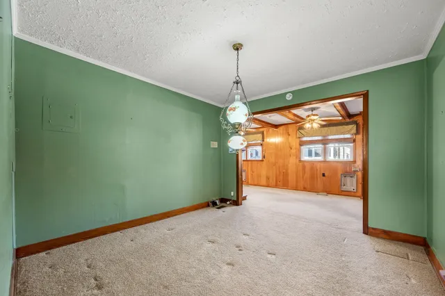 a bed room with a bed and a window