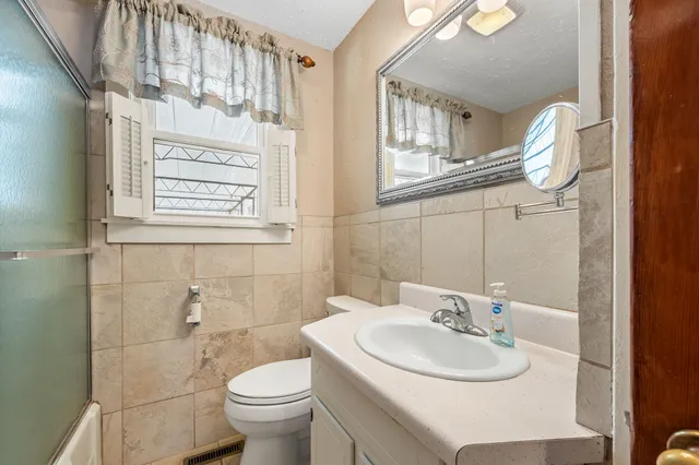 an empty room with closet and wooden floor