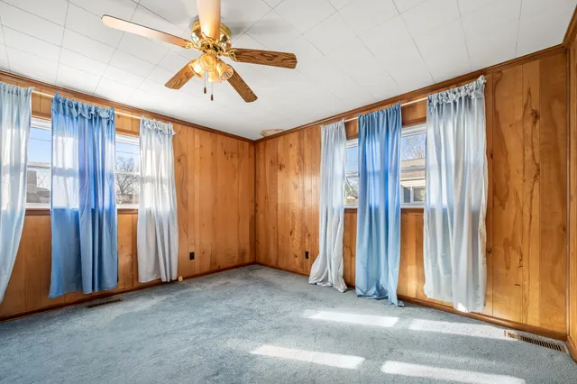 a bathroom with a double vanity sink mirror and shower