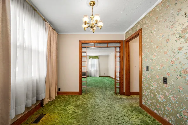 a bathroom with a granite countertop sink a mirror and a shower