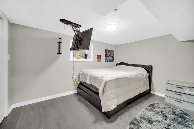 a bedroom with a bed and a couch