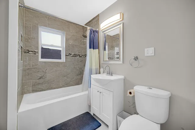 a bathroom with a toilet sink and bathtub
