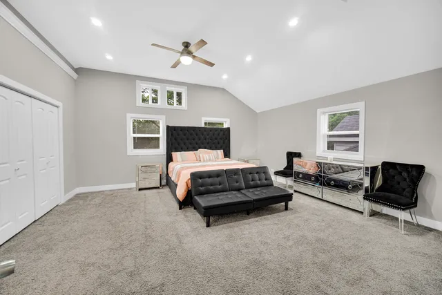 a bedroom with bed and window