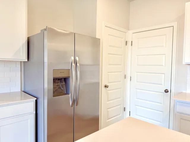 a bathroom with a shower and a sink