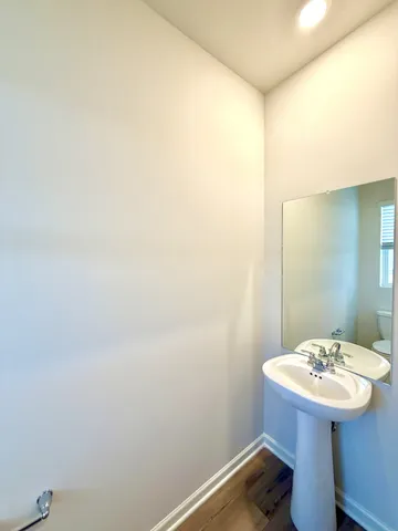 a bathroom with a sink and mirror