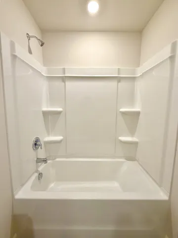 an empty room with a empty space and a window