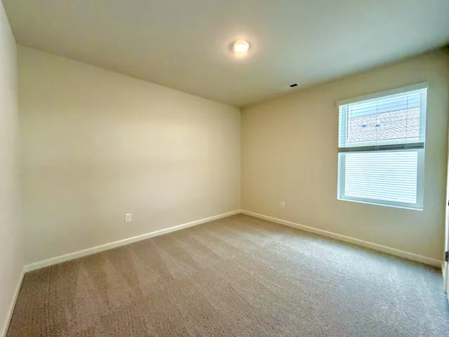 an empty room with closet and closet