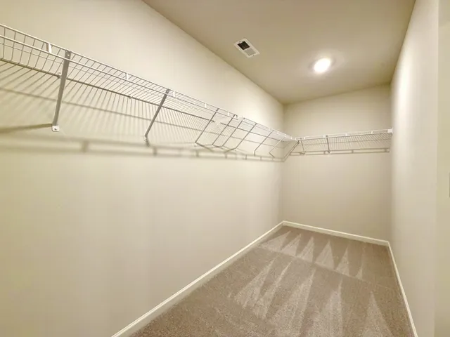 a view of a room with racks on the wall