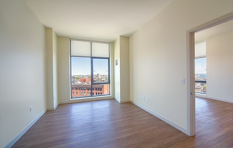 1 Canal Street, Unit 1105 Boston, MA 02114 - Photo 4 of 12 an empty room with wooden floor and a window
