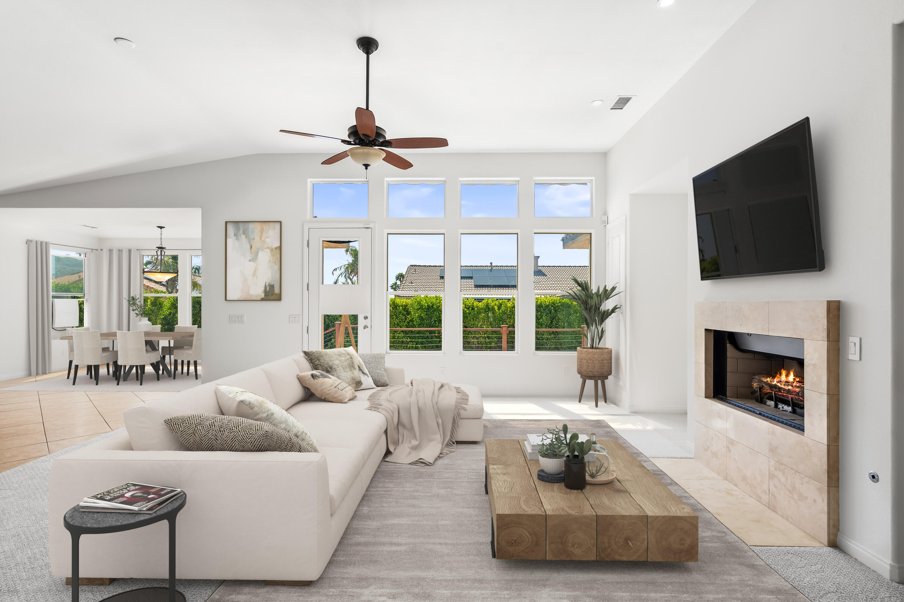 a living room with furniture a fireplace and a flat screen tv