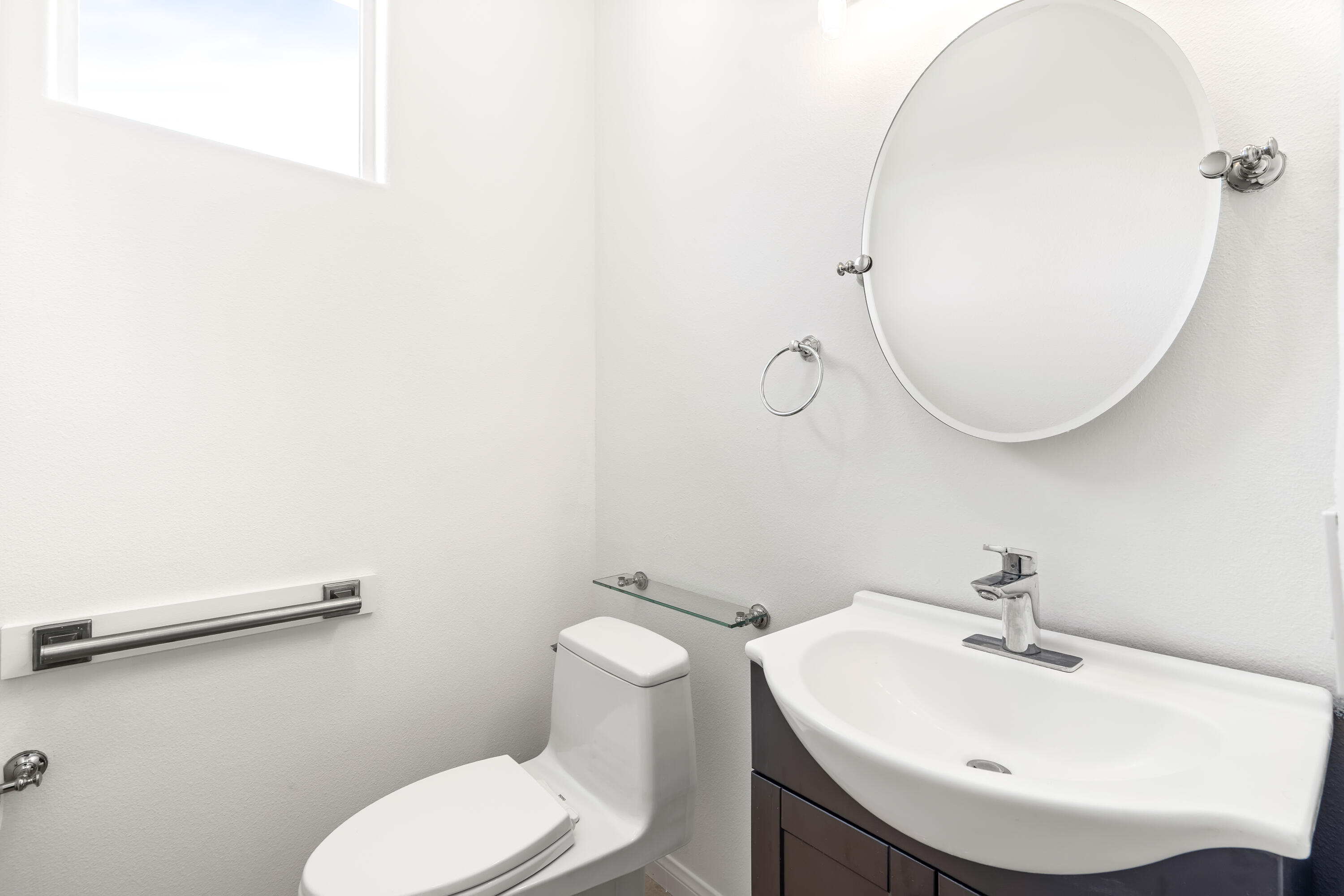 9580 Congressional Road Desert Hot Springs, CA 92240 - Photo 12 of 61 a bathroom with a sink mirror and toilet