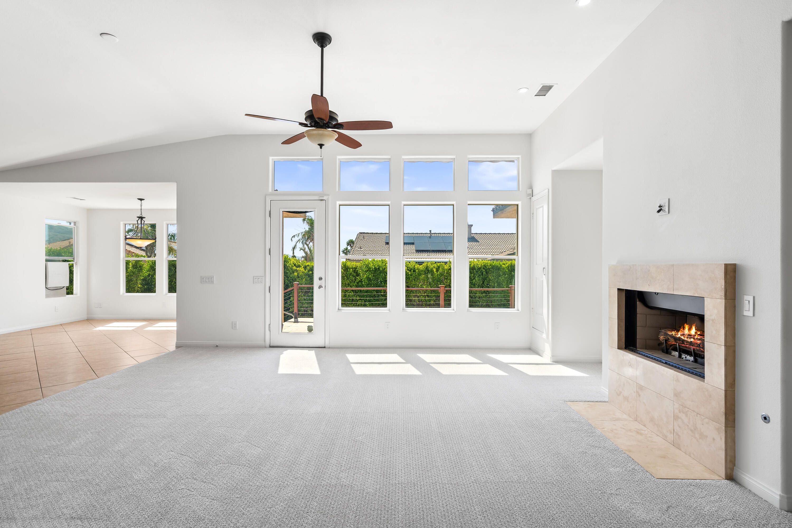 9580 Congressional Road Desert Hot Springs, CA 92240 - Photo 2 of 61 a view of an empty room with a fireplace and a window