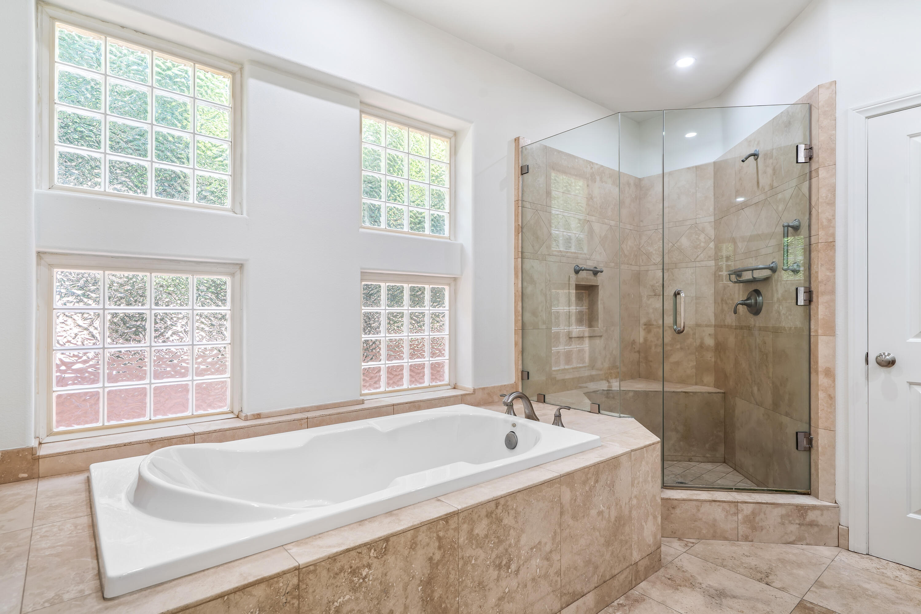 9580 Congressional Road Desert Hot Springs, CA 92240 - Photo 21 of 61 a spacious bathroom with a tub shower and windows