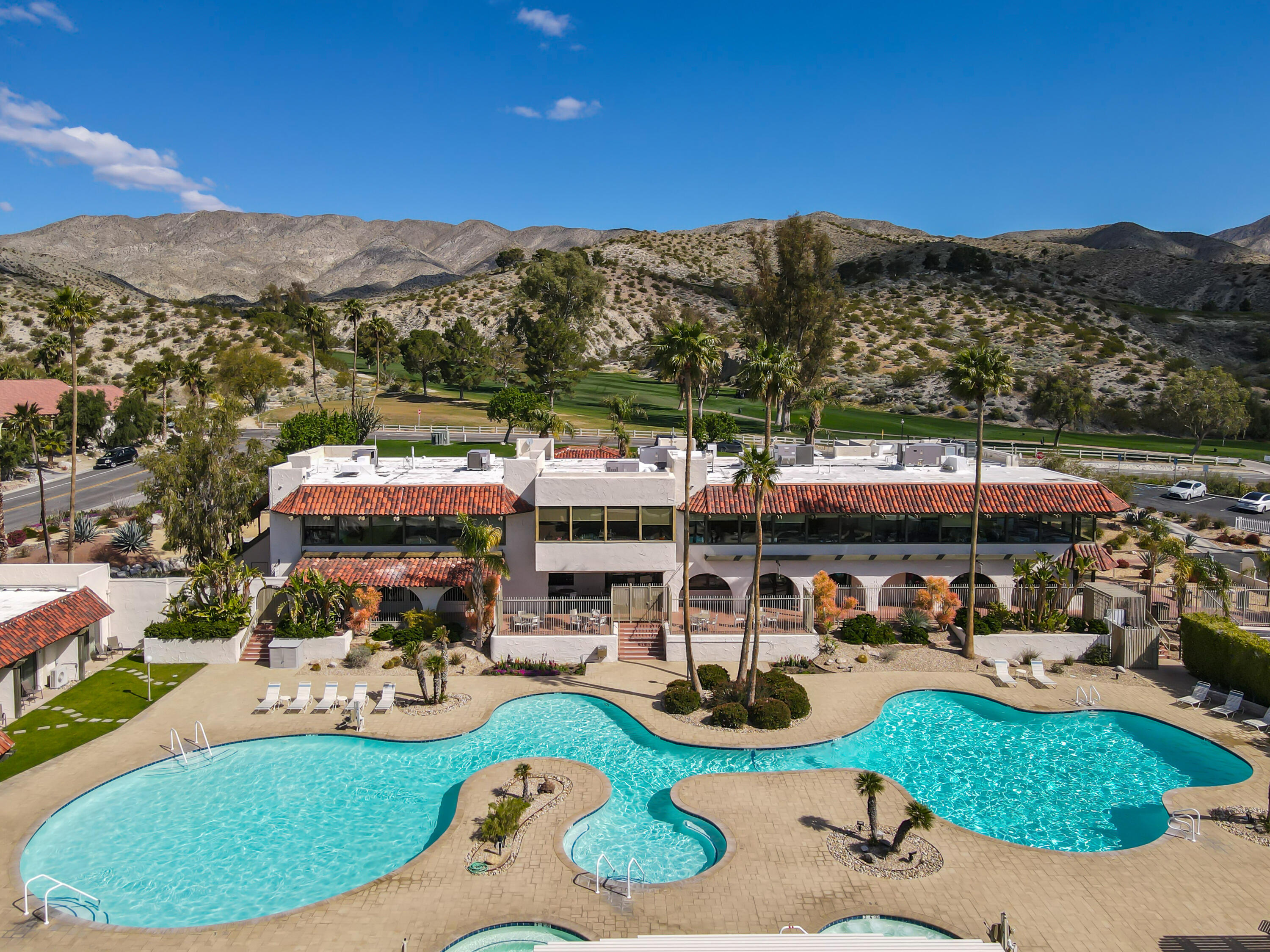 9580 Congressional Road Desert Hot Springs, CA 92240 - Photo 42 of 61 a view of a swimming pool with lounge chairs