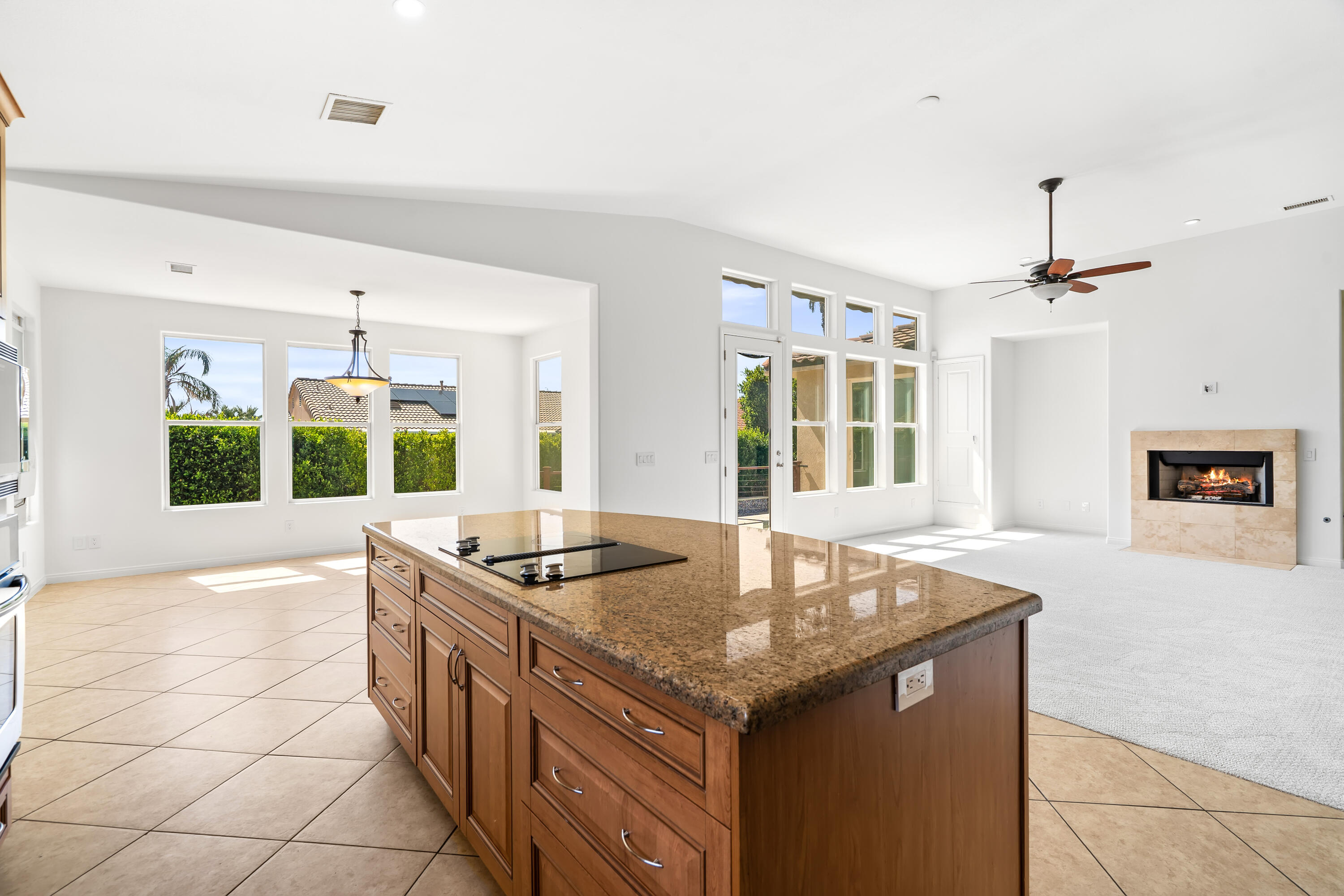 9580 Congressional Road Desert Hot Springs, CA 92240 - Photo 5 of 61 a kitchen with granite countertop a sink and a stove