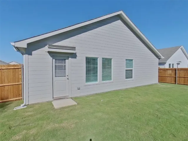 a view of backyard of house
