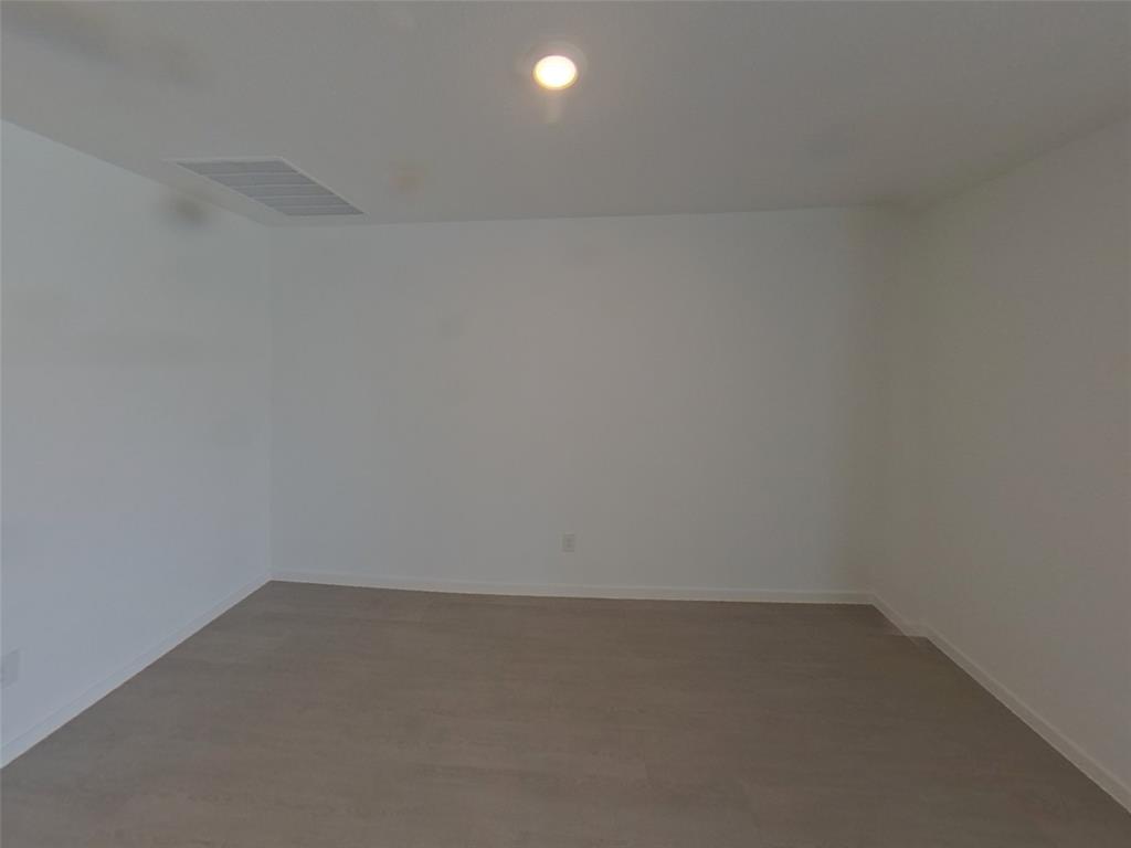 1613 Parlier Street McKinney, TX 75071 - Photo 3 of 22 a room that has a window in it