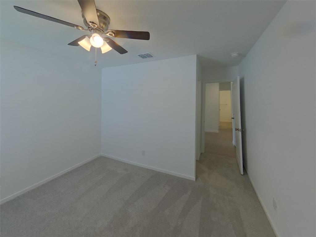 1613 Parlier Street McKinney, TX 75071 - Photo 4 of 22 an empty room with a chandelier fan