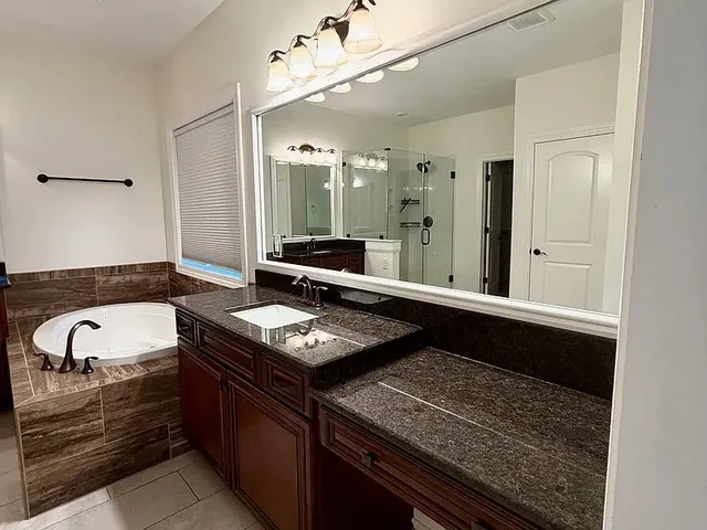 a kitchen with a stove and a sink