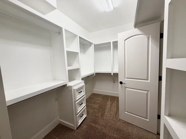 a view of cabinets with washer and dryer