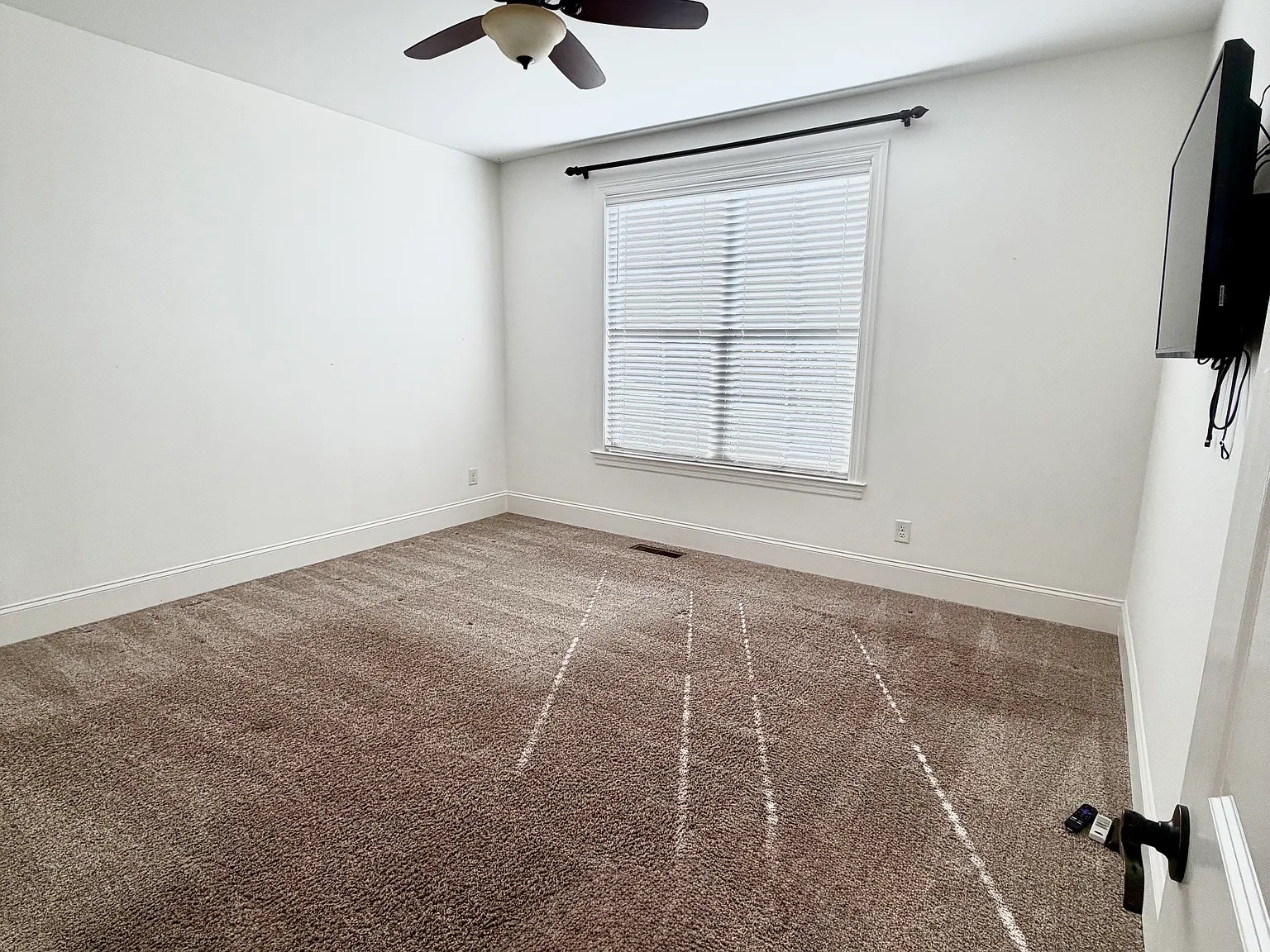 6664 Edgemoore Drive College Grove, TN 37046 - Photo 16 of 25 an empty room with windows and fan
