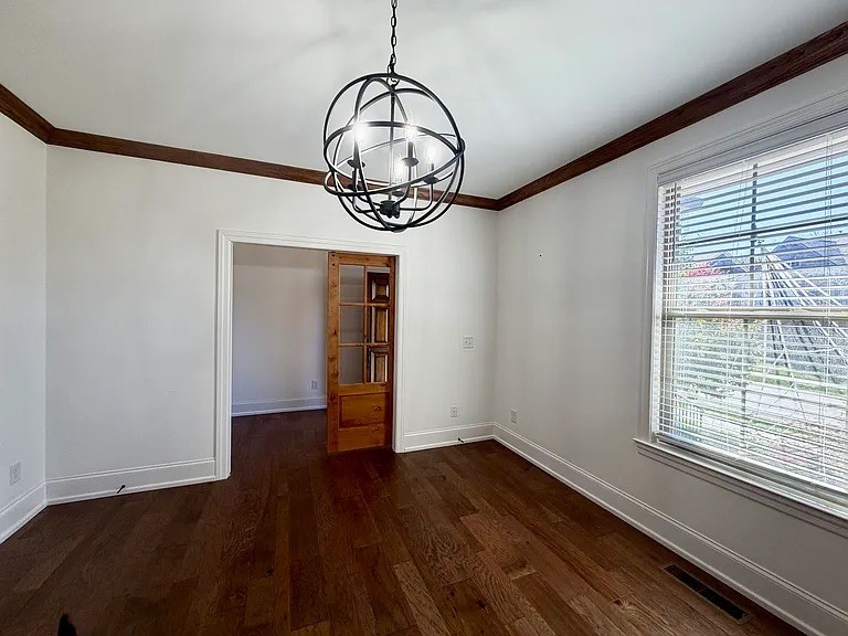 6664 Edgemoore Drive College Grove, TN 37046 - Photo 9 of 25 a view of a room with wooden floor water heater and a window