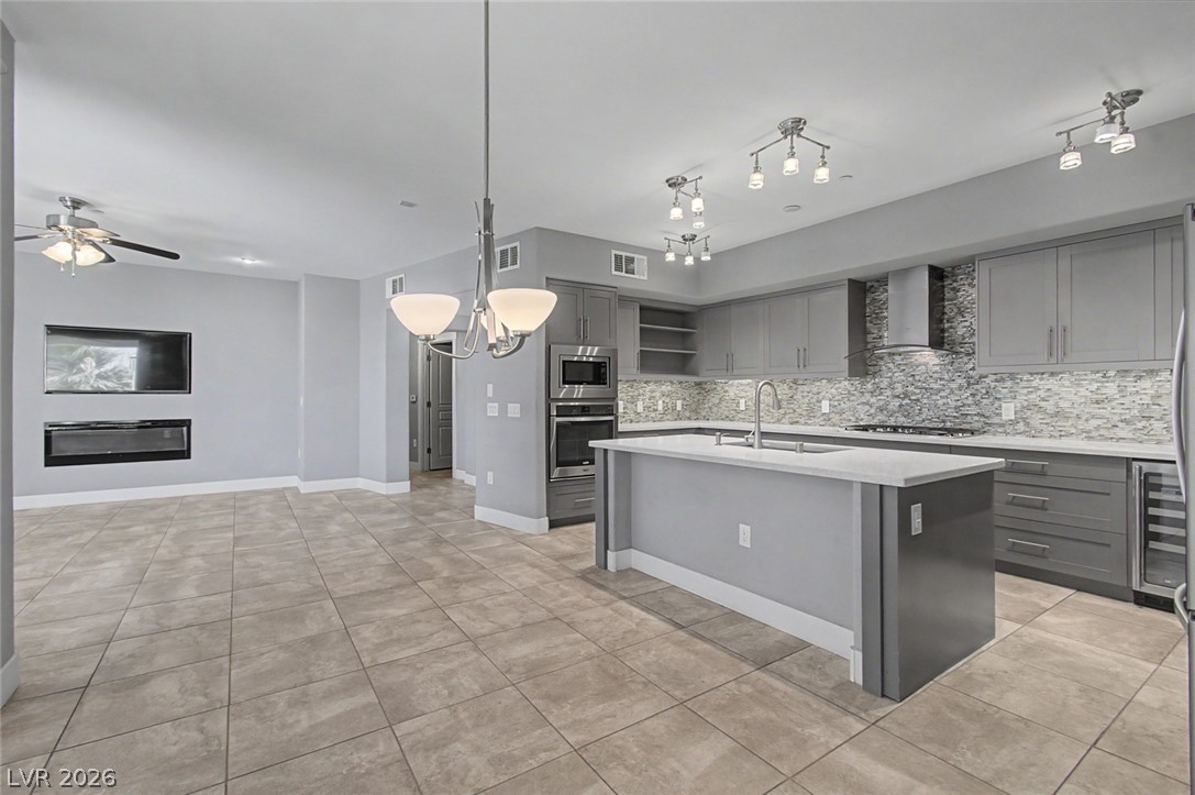 2555 Hampton Road, Unit 6308 Henderson, NV 89052 - Photo 15 of 30 An open-concept living space features an elegant kitchen, dinette and living room.
