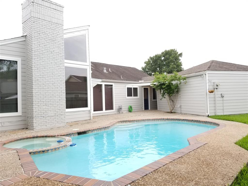 Enjoy swimming, grilling and dining al fresco in this beautiful backyard.