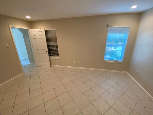 a view of an empty room and window