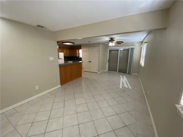 a view of a utility room with windows