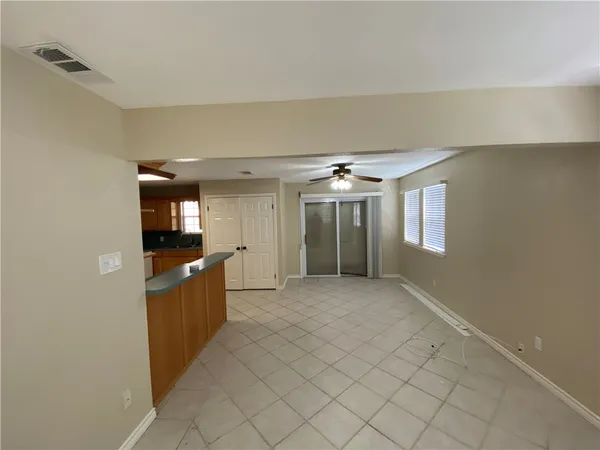 a view of a kitchen with furniture and a window