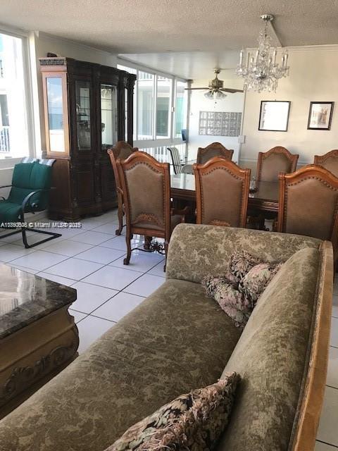 5401 Collins Avenue, Unit 819 Miami Beach, FL 33140 - Photo 23 of 40 a living room with furniture and a fireplace