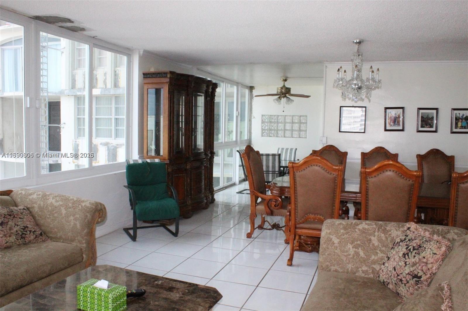 5401 Collins Avenue, Unit 819 Miami Beach, FL 33140 - Photo 25 of 40 a living room with furniture potted plant and a window