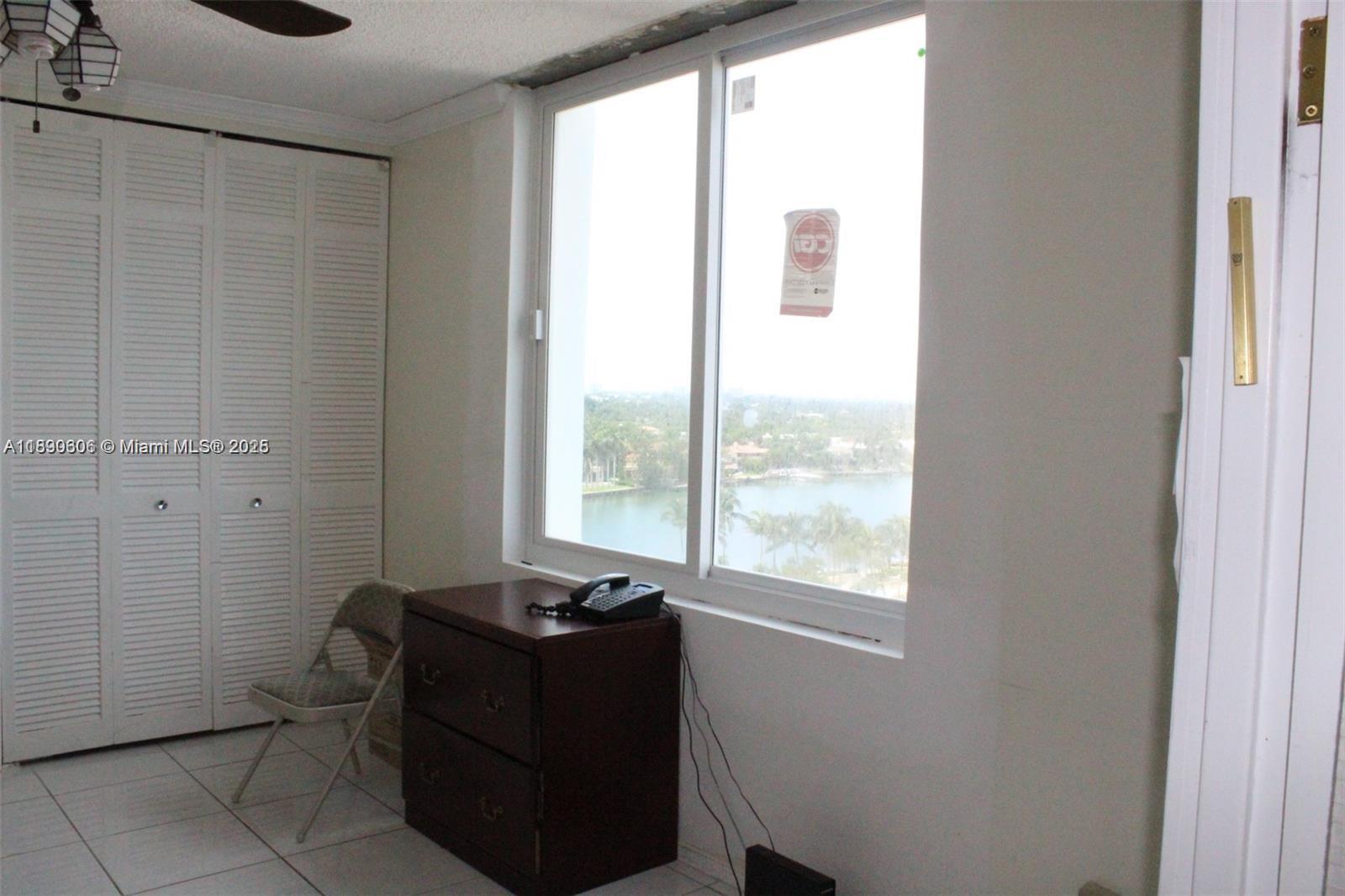 5401 Collins Avenue, Unit 819 Miami Beach, FL 33140 - Photo 28 of 40 a living room with furniture and a window