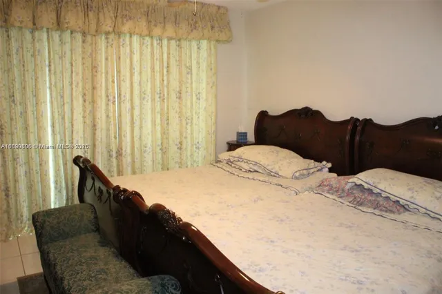 a kitchen with stainless steel appliances granite countertop a sink a refrigerator and a stove top oven