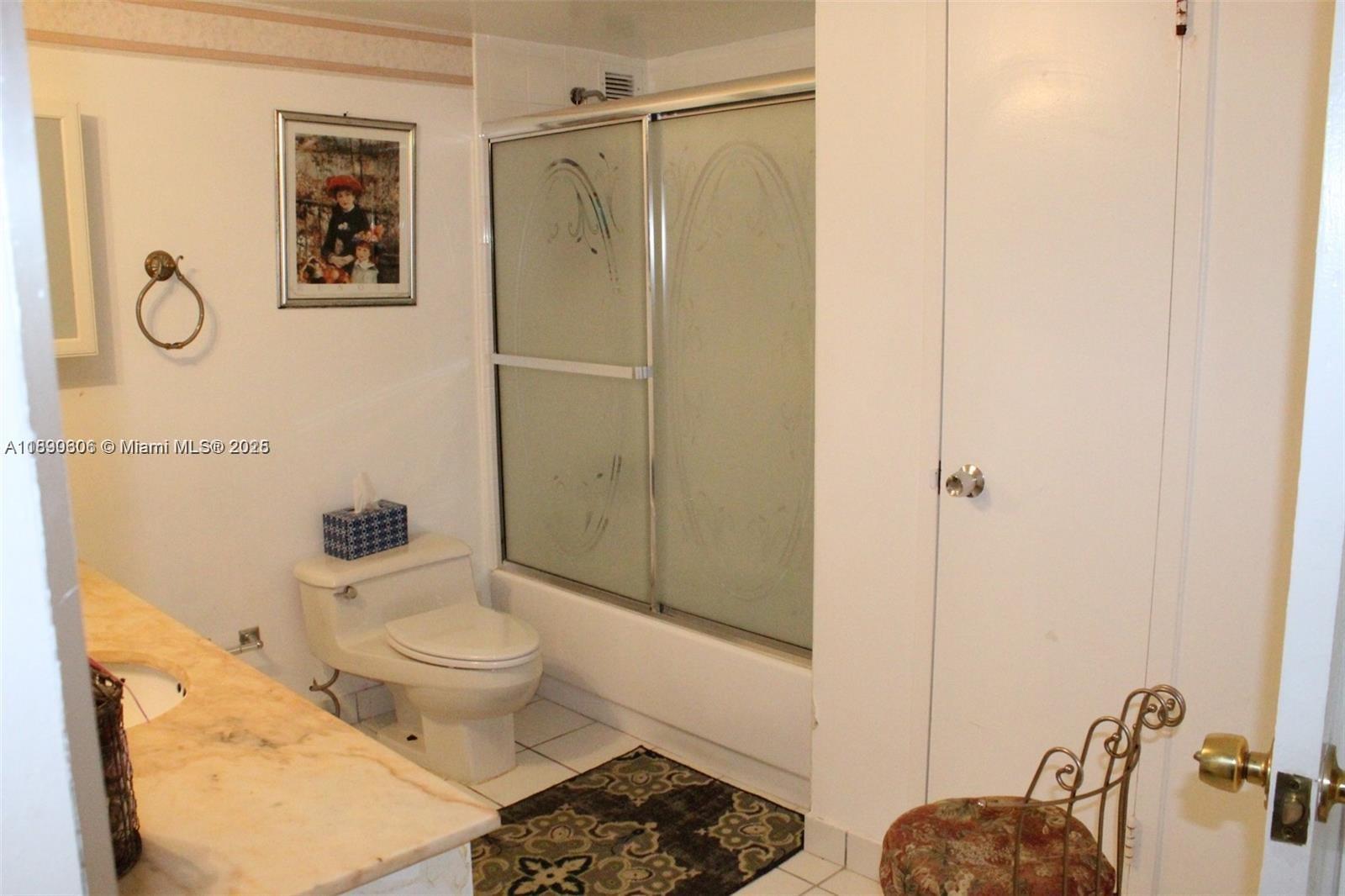 5401 Collins Avenue, Unit 819 Miami Beach, FL 33140 - Photo 33 of 40 a bathroom with a toilet sink and shower