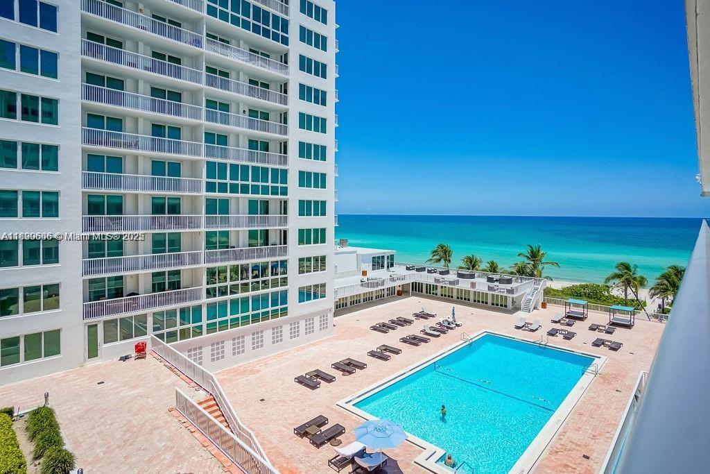 5401 Collins Avenue, Unit 819 Miami Beach, FL 33140 - Photo 10 of 40 a view of a swimming pool and an outdoor space