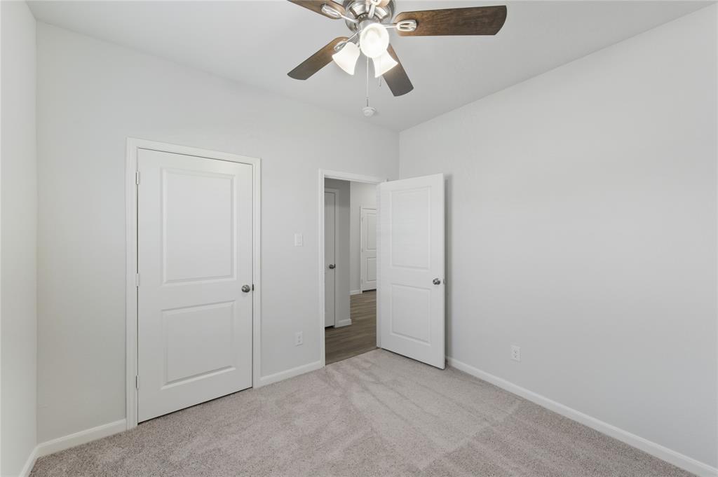 404 Jameson Springtown, TX 76082 - Photo 11 of 16 a view of an empty room and chandelier fan