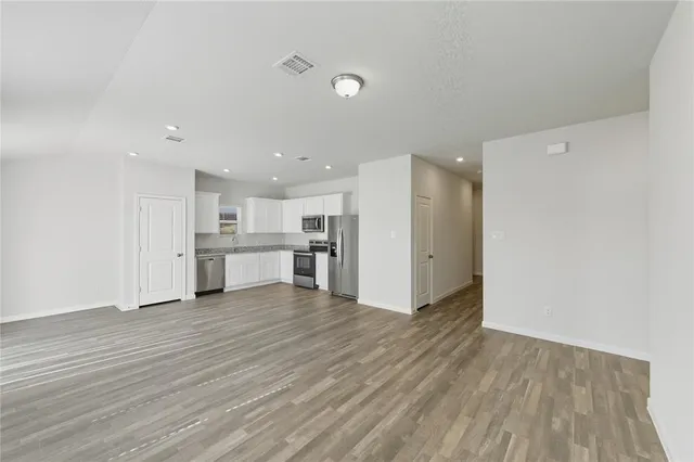 a view of kitchen with wooden floor
