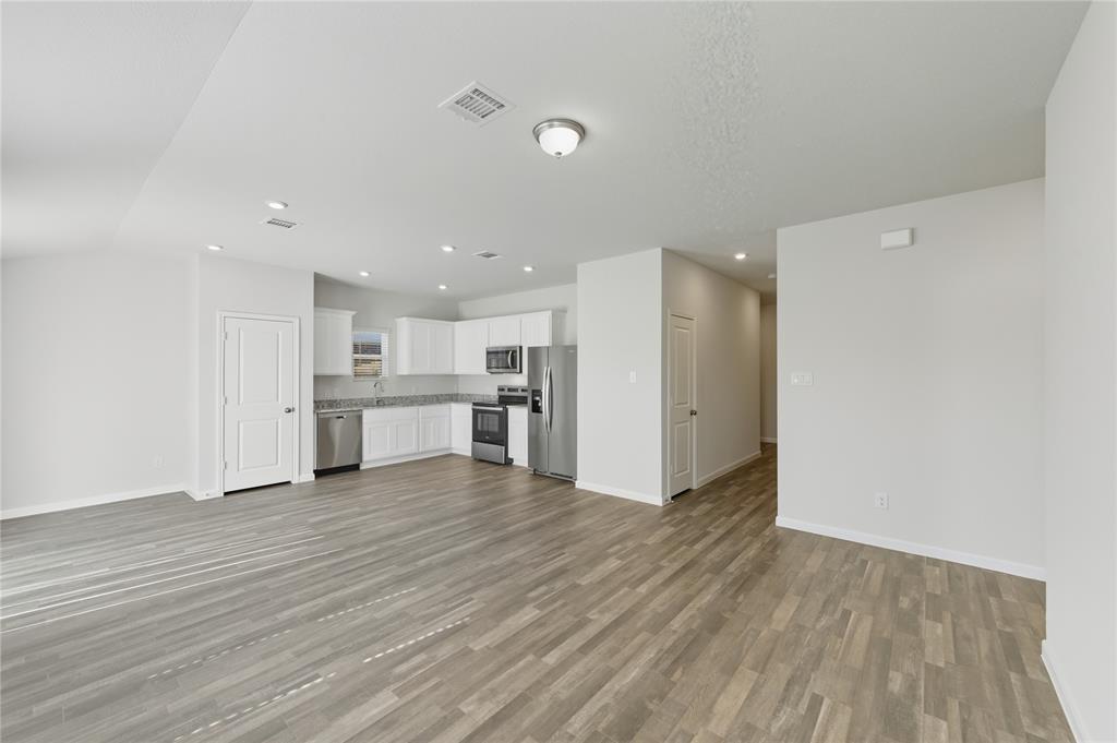404 Jameson Springtown, TX 76082 - Photo 8 of 16 a view of kitchen with wooden floor