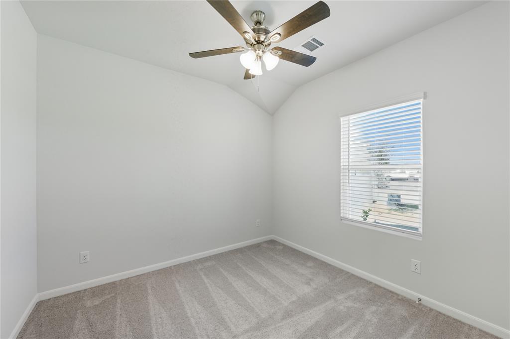 404 Jameson Springtown, TX 76082 - Photo 10 of 16 an empty room with a window and a fan