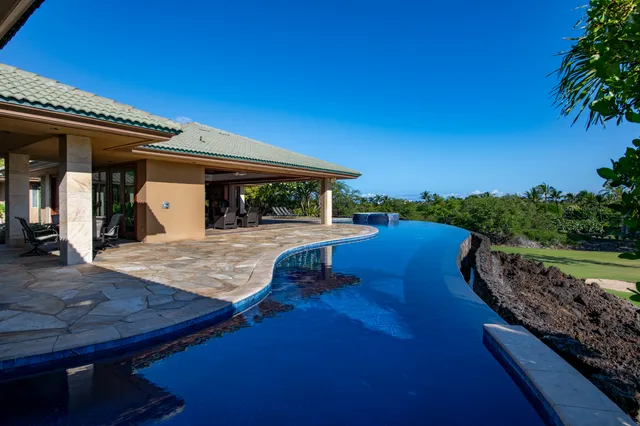 a view of a swimming pool with a patio