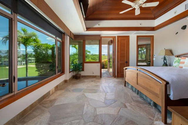 a large room with a large window and furniture