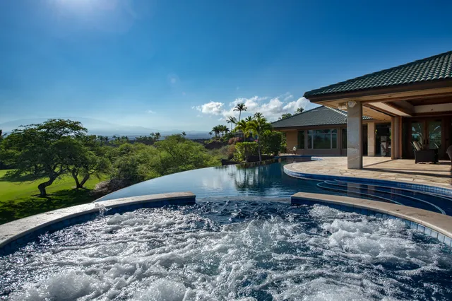 a view of a swimming pool with a patio