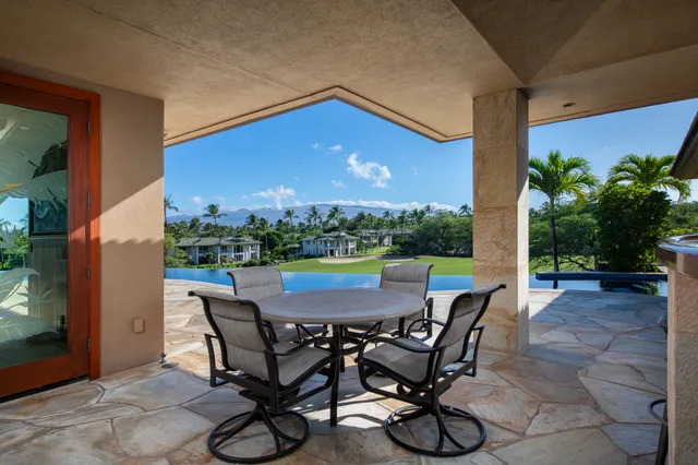 a view of an outdoor sitting area with furniture and garden