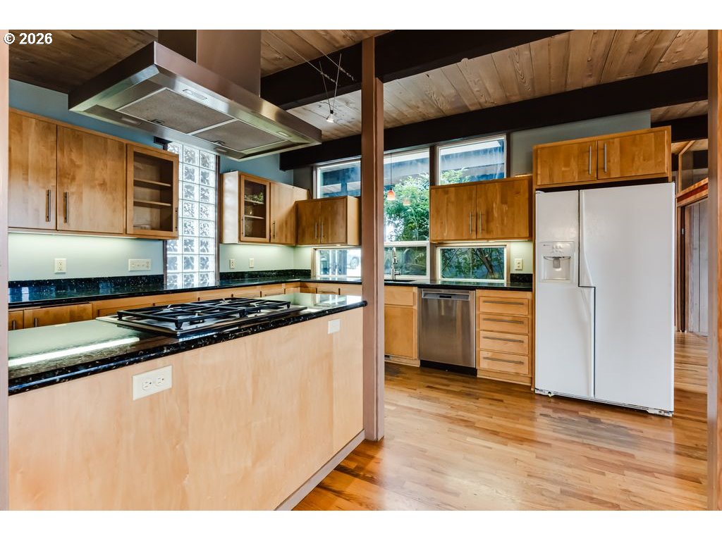 2055 Broadview Street Eugene, OR 97405 - Photo 14 of 45 a kitchen with stainless steel appliances granite countertop a stove and a refrigerator